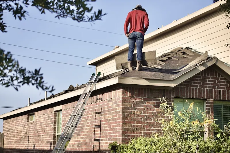 Professional roofer working on a residential roof in Barefoot Bay
